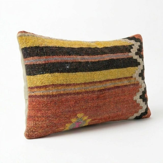 This beautiful 16'' x 24'' hand-woven Kilim pillow cover was made from an authentic Turkish kilim. The traditional flat-...