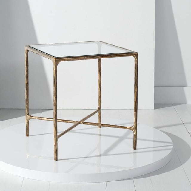 Introducing the Jessa forged metal square end table in brass, a captivating blend of style and functionality. This...