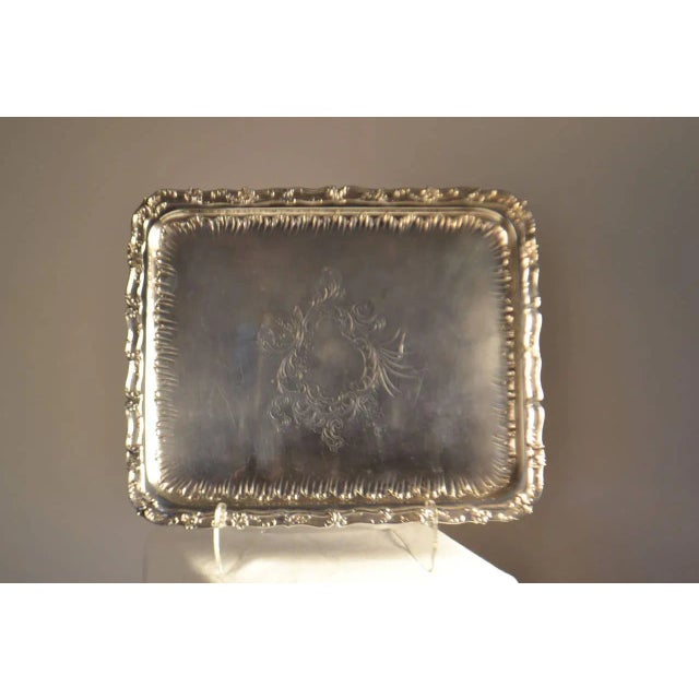 Gorgeous sterling silver tray with interior gadrooned border and central cartouche and floral motif.