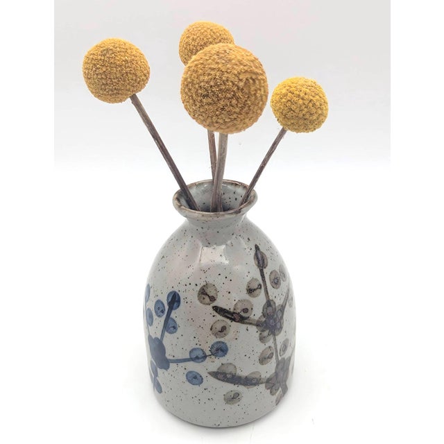 Offered is a vintage glazed stoneware bud vase made in Japan in the mid to late 1980s. Done in light gray with brown...
