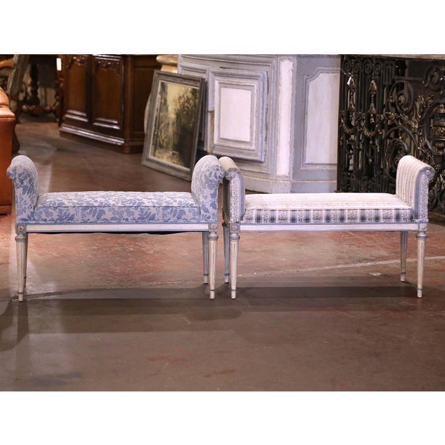 This elegant pair of Louis XVI style painted wood benches was crafted in northern France circa 1980. Each bench stands on...