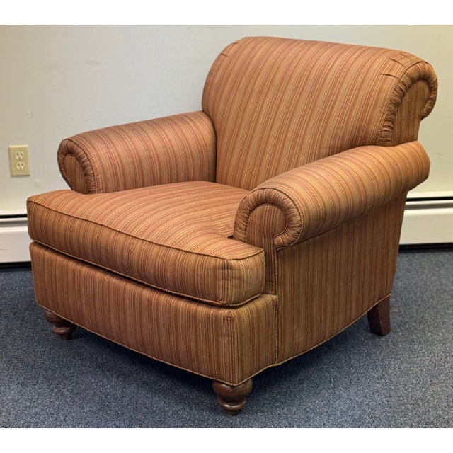 Beautiful Ethan Allen upholstered armchair featuring a classic, timeless silhouette with generously rolled arms, a plush...