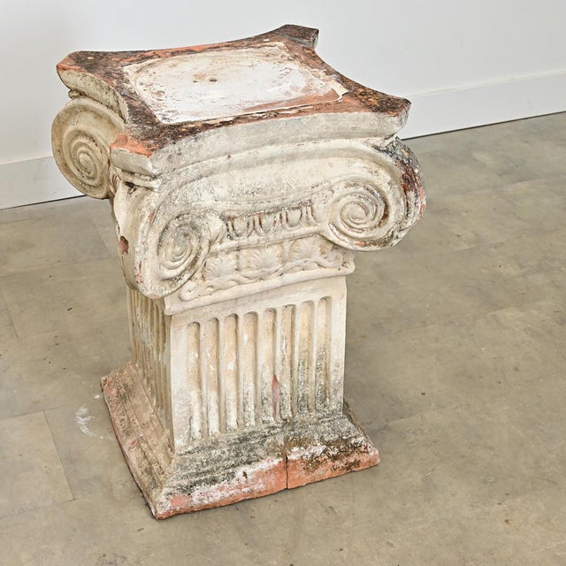 An infinitely useful English, late 19th century, painted terracotta pedestal for Neoclassical beauty in any garden or...