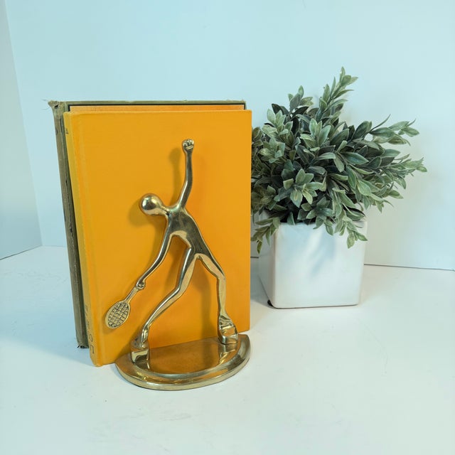 This is a Mid-Century Modern brass tennis player bookend set, likely produced in the 1960s. I love the movement in this...