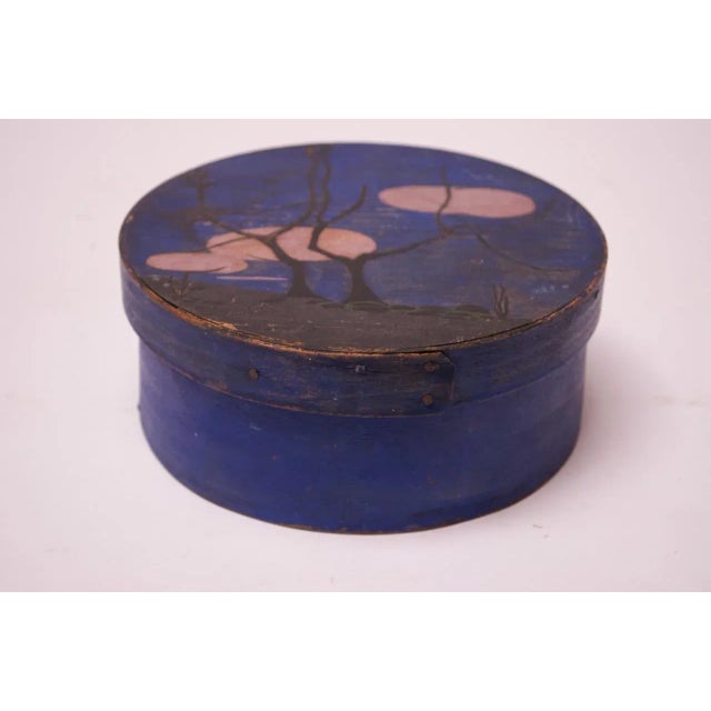 Charming circa 1910-1920 Americana pantry box with hand-painted night-scape detail. Indigo background and black trees are...