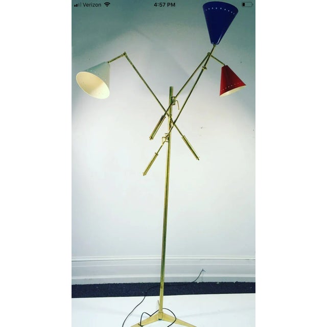 Triennale floor lamp Arredoluce style, 21st century. Made in Italy. Great condition. Measures 85" high, each arm measures...