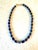 Gorgeous lapis beaded necklace with gold tone spacers and clap. Designed by Matthew Izzo