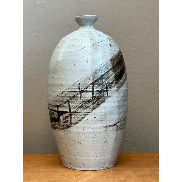 This vintage handcrafted stoneware vase is a beautiful expression of Mid-Century Modern studio pottery, distinguished by...