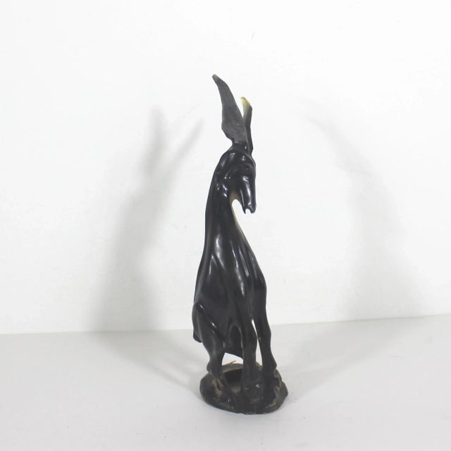 Amazing carved horn animal. I think it is a ram, but could be an antelope, goat, deer gazelle? It was made mid century....