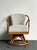 This iconic swivel chair, crafted by the renowned Heywood Wakefield during the 1950s, is a quintessential example of mid-...