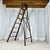 Large wooden painter's stepladder, patinated, 20th century. Dimensions: 110 x 60 cm Height: 186 cm Folded: 208 x 65 x 20...