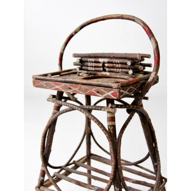This is an antique Adirondack style twig table. The rustic wood accent table features a wooden twig frame with bentwood...
