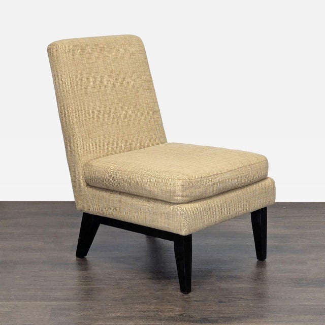 This West Elm lounge chair features a simple and modern design, perfect for any living room or lounge area. The chair is...