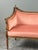 Elegant Louis XVI style sofa in carved and molded wood resting on fluted, tapered legs. The gently curved back and console...
