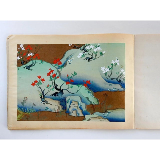 Vintage bound volume of 12 Japanese block prints on paper. Multi color, each could be framed if removed from binding....