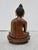 Bronze Buddha with polychrome face, Classic seated Buddha with an alms bowl, and touching the earth. Late 20th century,...