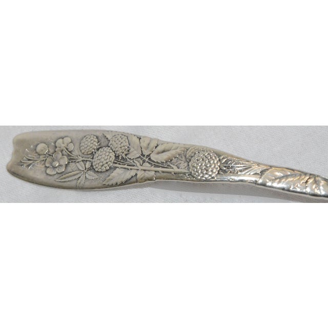 This is a lovely pattern of a variety of flowers on the handle of a sterling silver ladle. The handle is marked "Sterling"...
