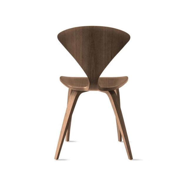 The molded plywood side chair by norman cherner, dating back to 1958, is the perfect companion to the classic cherner...