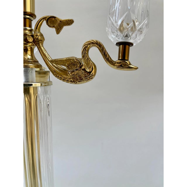 Gorgeous column table lamp resting on Lucite base with brass detailing and brass swan arms with crystal votive holders....