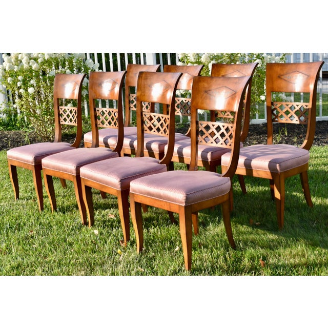 Vintage (1960's) Set of 8 Dining Chairs have an Italian Regency Style. Made of Wood with Brass Inlay and Lattice Like...