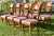 Vintage (1960's) Set of 8 Dining Chairs have an Italian Regency Style. Made of Wood with Brass Inlay and Lattice Like...