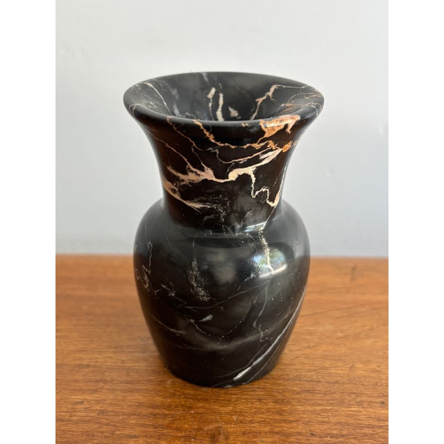 Lovely and heavy for its diminutive size, this 1970s bud vase sculpture is cut from veined black marble. Marked on bottom...