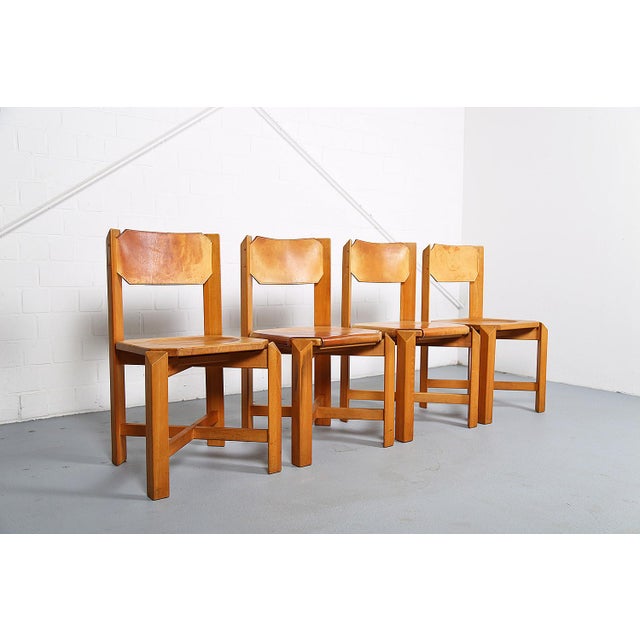 A set of four rare chairs reminiscent of designs by French designer Pierre Chapo or Maison Regain. The massive, heavy...