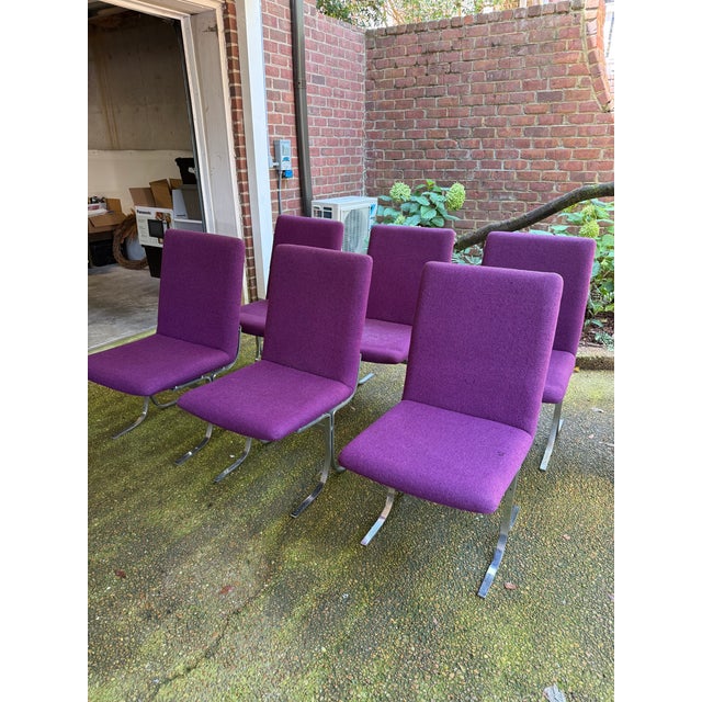 Unique set of 6 mid century-dining chairs by Danish designer Dyrlund, featuring a minimalist sled- style base in a chrome...