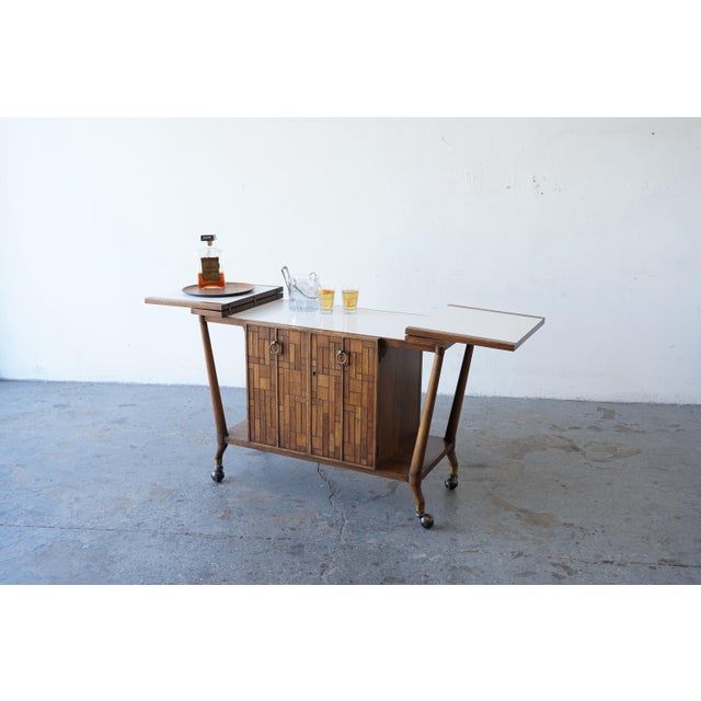 Charming vintage bar cart designed by Bert England for Johnson Furniture from the Forward Trend collection rolling bar...
