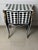 A Louis XV courtly checkered table with storage in a black, white, and gold color scheme would be a luxurious and opulent...