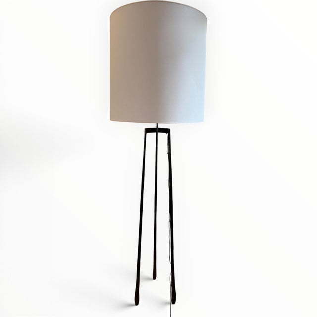 Floor lamp from design legend Christian Liaigre (French, 1943-2020). The Liseron lamp is comprised of a forged blackened...