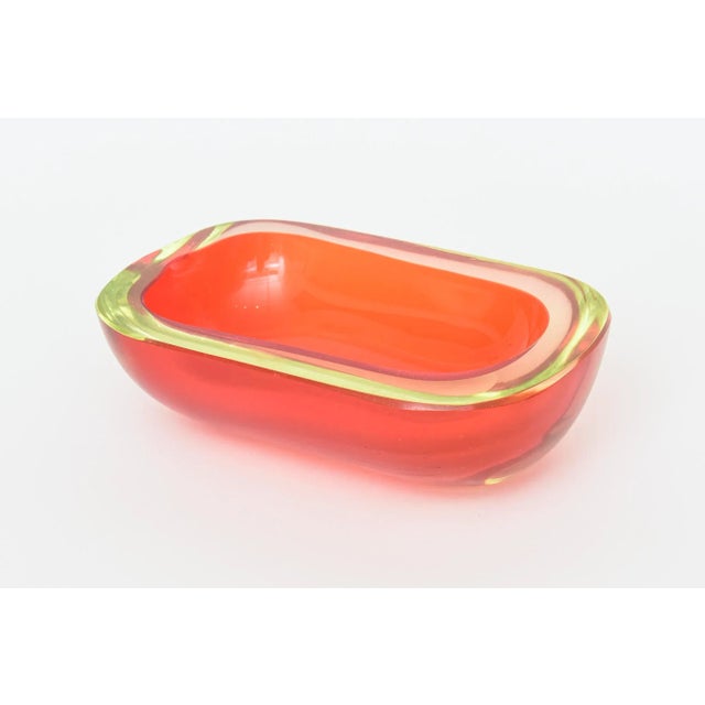 This fabulous and unusual vintage Murano Flavio Poli Murano glass sommerso bowl is oblong with a flat cut polished top....