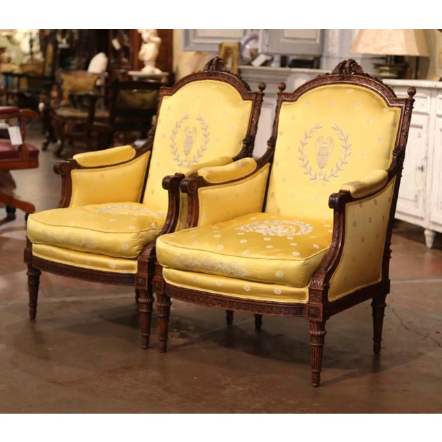 This elegant pair of antique French bergères brings strong presence and refined Louis XVI detailing, highlighted by...