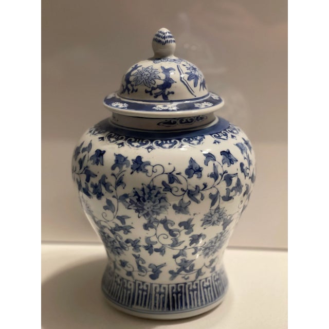 Beautiful porcelain ginger or tea pot. Decorative pot that can be used as a storage pot or as a flower vase. Blue flower...