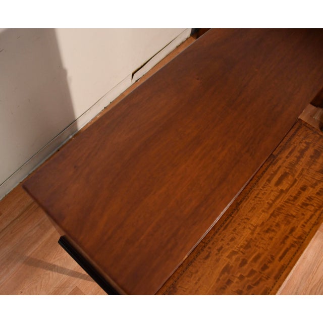 We are pleased to offer this beautiful English Hepplewhite tambour desk, from the 1900s. This desk is made of Mahogany &...