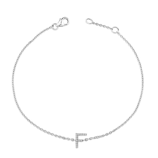 Immerse yourself in the understated elegance of this 10K white gold bracelet, rhodium-plated for an enrapturing shimmer...
