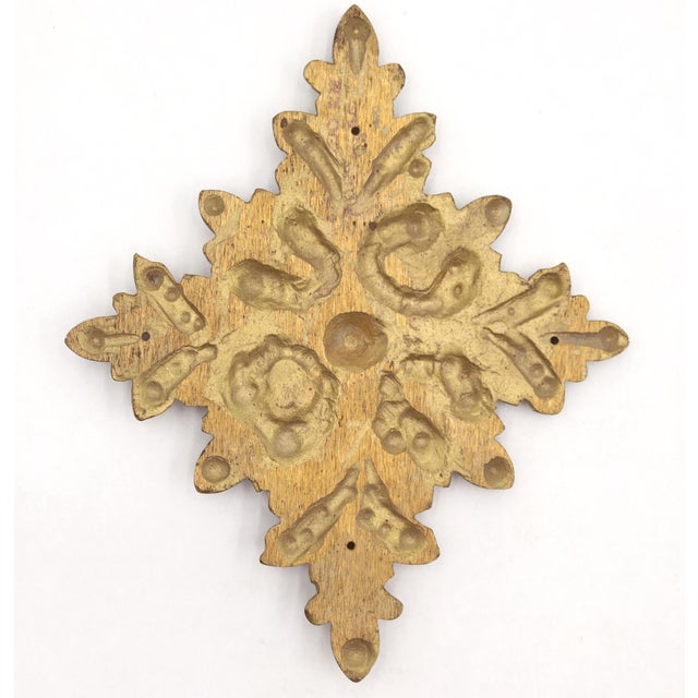 French style brass applique with acanthus scrollwork in a cross shape. The original mounting screws are not available....