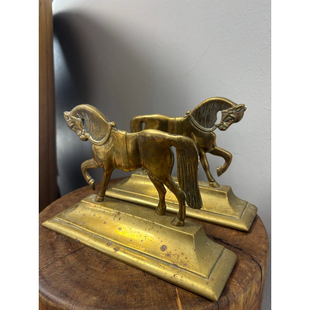 A handsome pair of antique English brass horse figures, designed to serve beautifully as either doorstops or bookends....
