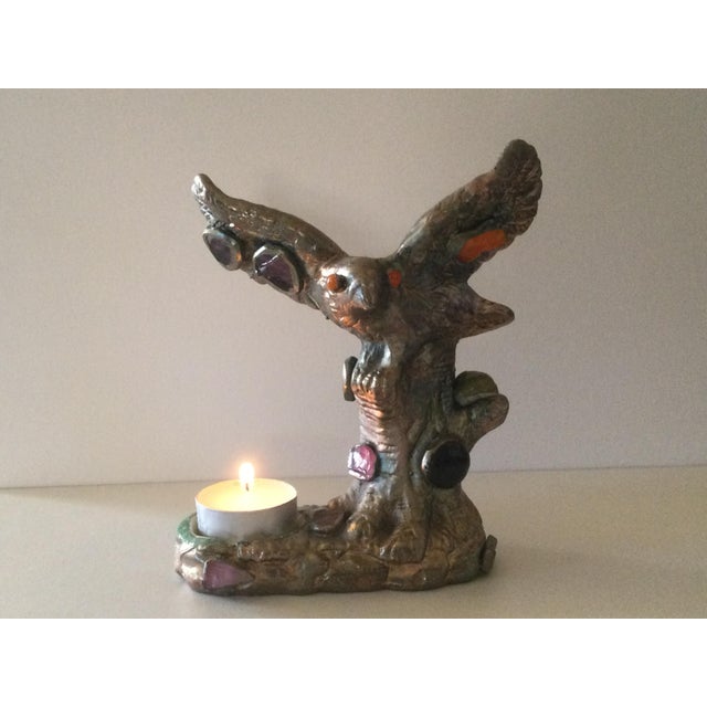This Imperial Eagle candle holder is made of ceramic in a mold. The ceramic was then coated using electrolysis with a...