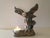 This Imperial Eagle candle holder is made of ceramic in a mold. The ceramic was then coated using electrolysis with a...