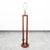 A mid century modern designed Mahogany floor lamp. Lamp is tested and works well. Unique and well constructed.