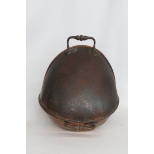 This amazing Coal Bucket / Scuttle is made of copper. This incredible antique piece has wonderful rustic style from the...
