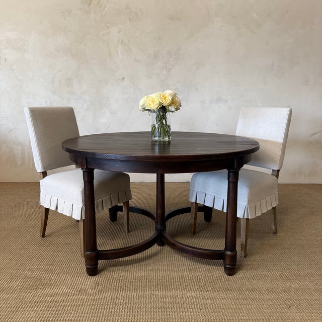 Crafted from solid reclaimed elm wood, the Canterbury Dining Table showcases the natural beauty and character of aged...