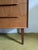 Vintage Danish teak chest of drawers from the 1950s with six drawers and integrated handles, featuring an elegant vertical...