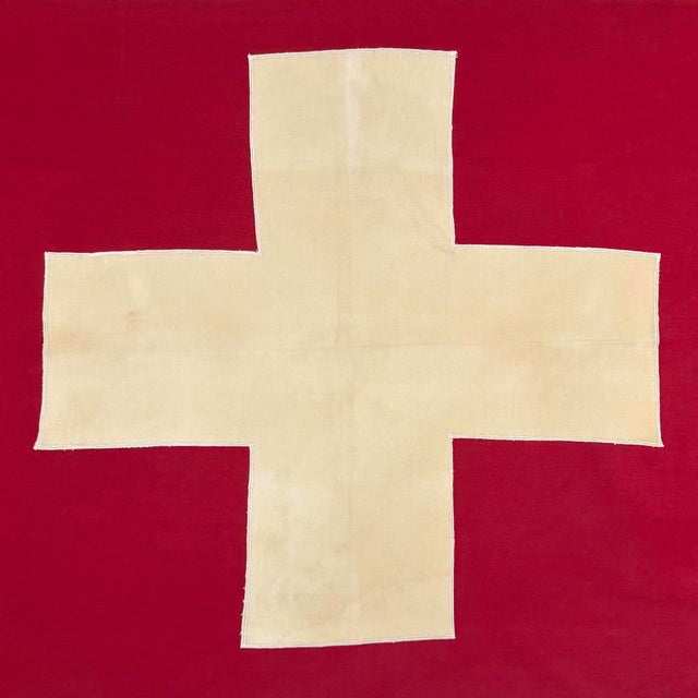 This vintage Swiss flag is made from a cotton cloth, with fully sewn cross visible on both sides. Please note overall...