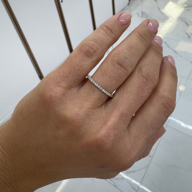 Gender: Ladies Metal Type: 10K White Gold Ring Size: 7 Width: 1.65 mm Weight: 1.47 grams One ladies 10K white gold diamond...