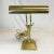 This is a vintage Art Deco style Piano Desk Lamp from the 1970s. It features a pyramid base and a swirled accent on the...