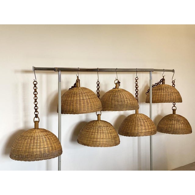 Set of 7 wicker and bamboo chandeliers 70s. Up to 250V (Europe/UK Standard).The wiring of this item may be original and...