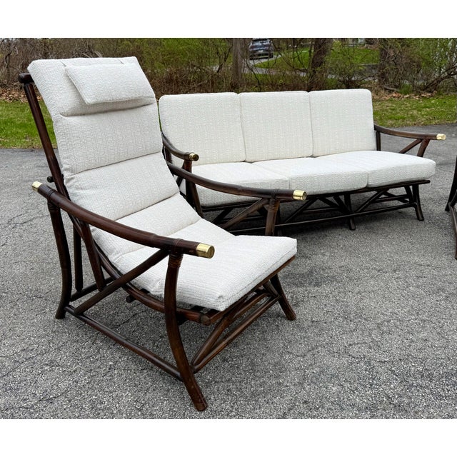 A beautiful and stylish mid century modern boho chick bamboo sofa, lounge chair and sling chair set in the style of Ficks...