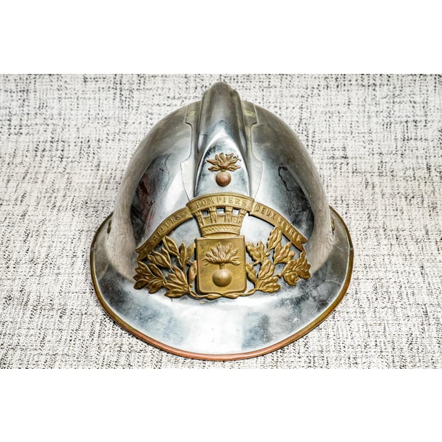 A beautiful early 20th Century French fireman’s helmet, finely crafted and impressively heavy. The helmet is formed from a...